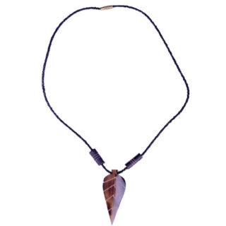 A BLACK BEADED NECKLACE WITH A COW-BONE LEAF SHAPED PENDANT