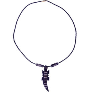 A BLACK BEADED NECKLACE WITH A COW-BONE CROCODILE SHAPED PENDANT