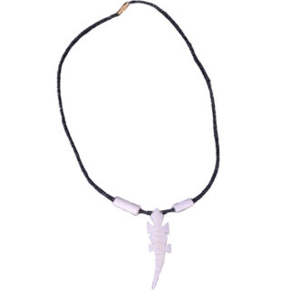 A BLACK BEADED NECKLACE WITH A PLAIN COW-BONE CROCODILE SHAPED PENDANT